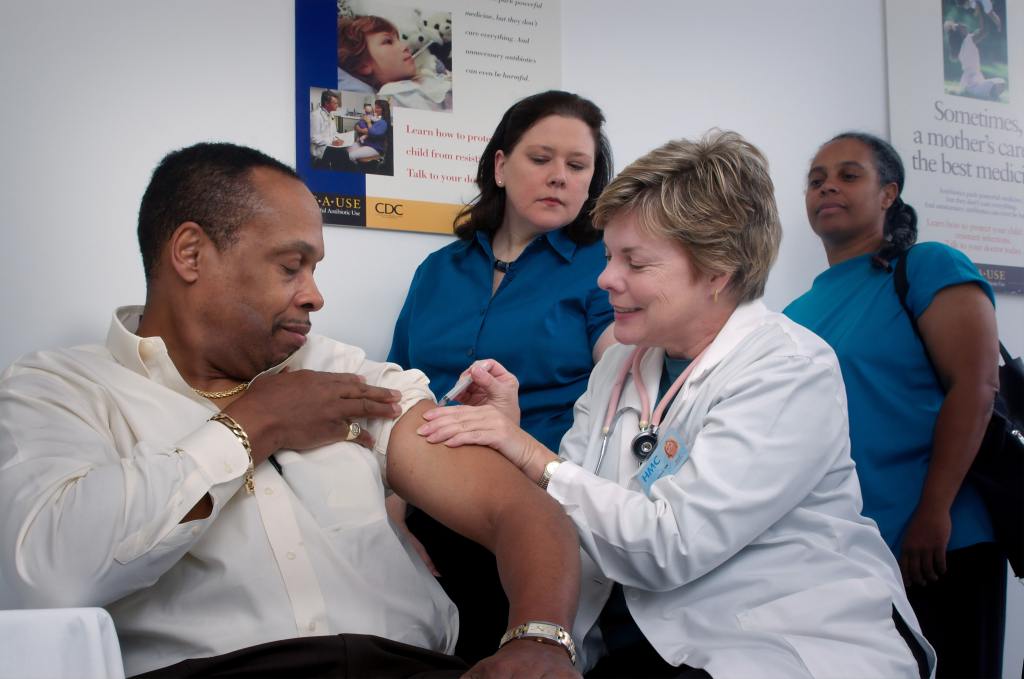 photo of doctor with spanish speaking patient and spanish speaking interpreter